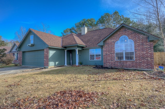 view of front facade with a garage and a front lawn