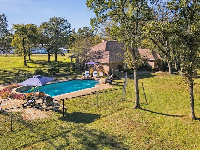 view of pool featuring a yard and a patio area