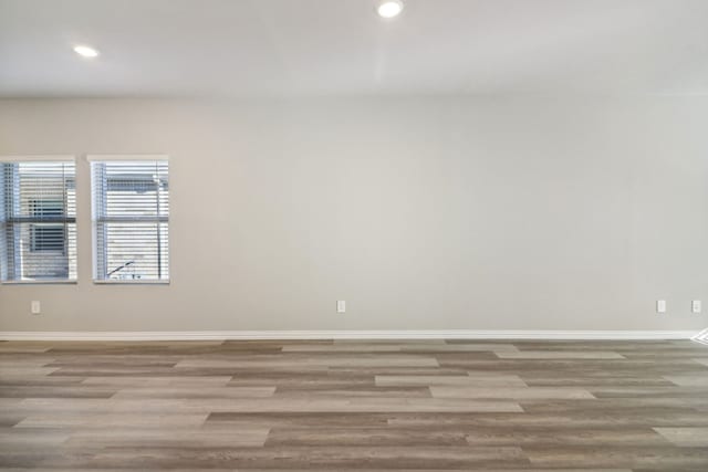 unfurnished room with light hardwood / wood-style flooring