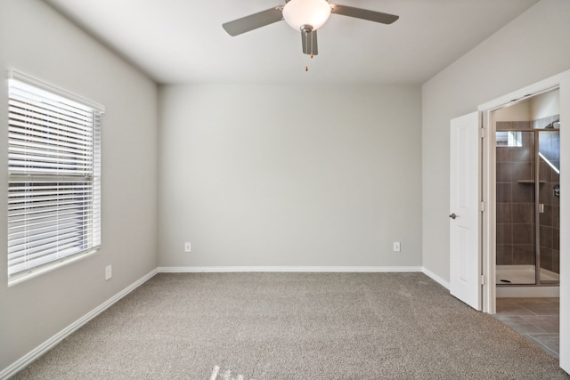 unfurnished room with ceiling fan and carpet floors