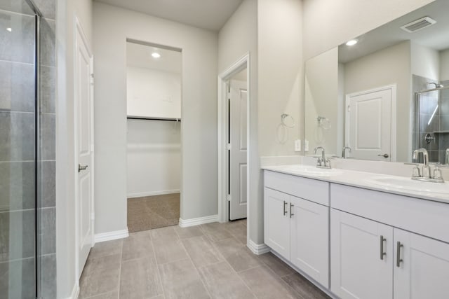 bathroom featuring vanity and a shower with shower door