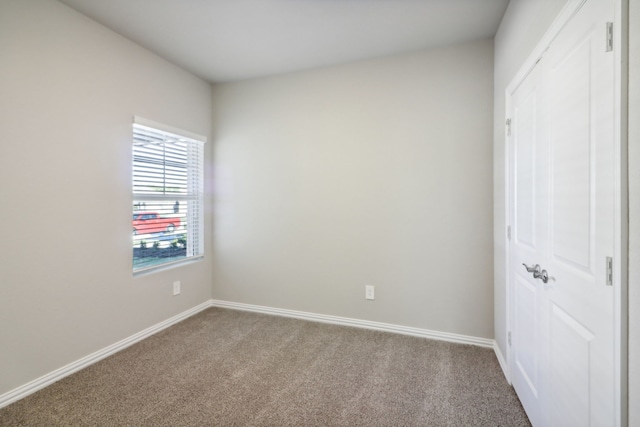 unfurnished bedroom featuring a closet and carpet