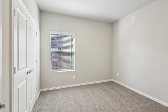 unfurnished room featuring carpet flooring