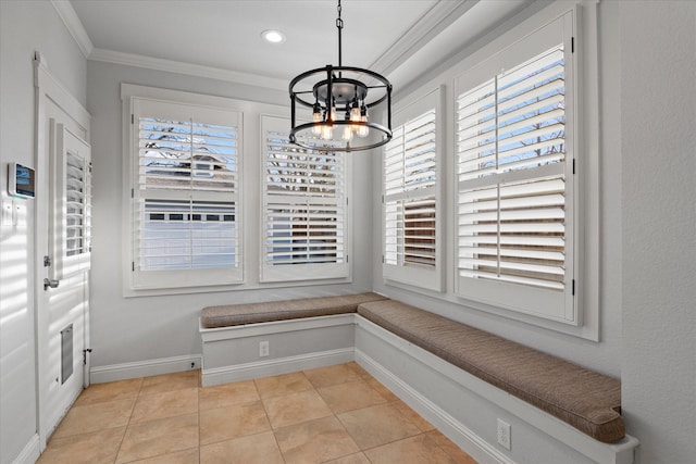 dining room featuring an inviting chandelier, ornamental molding, and light tile patterned floors