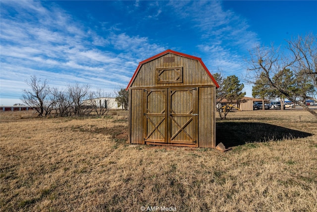 view of outdoor structure with a lawn