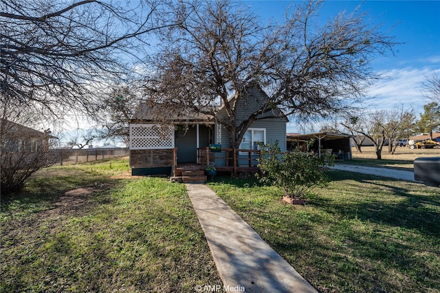 bungalow-style house featuring a front lawn and a deck