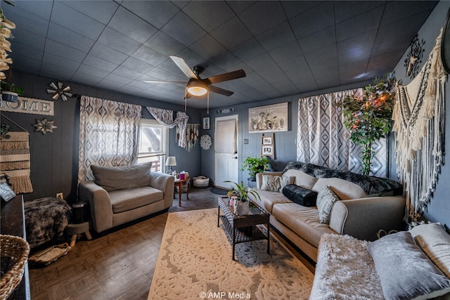 living room featuring parquet floors and ceiling fan