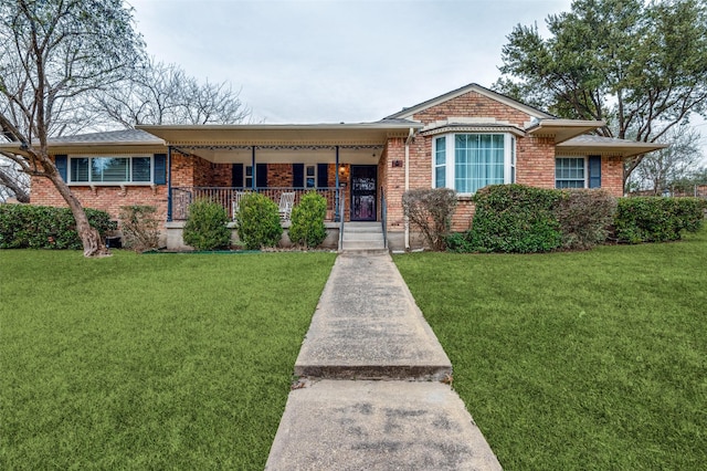 single story home with a front yard and covered porch