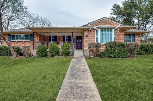 ranch-style house with a front lawn and covered porch