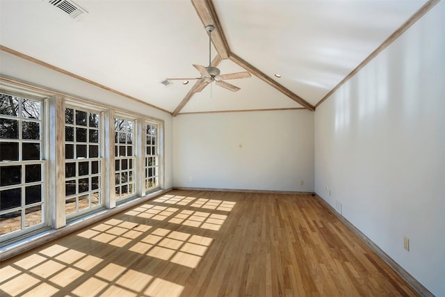 unfurnished sunroom with vaulted ceiling with beams and ceiling fan