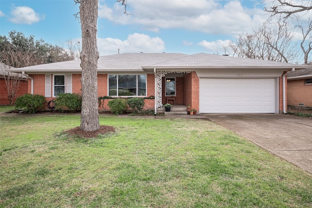 single story home featuring a garage and a front yard