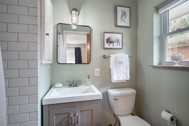 bathroom featuring vanity and toilet