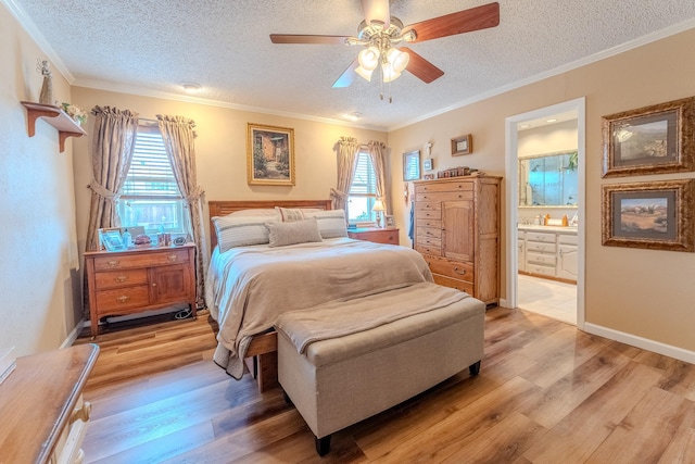 bedroom featuring ceiling fan, connected bathroom, light hardwood / wood-style flooring, and a textured ceiling