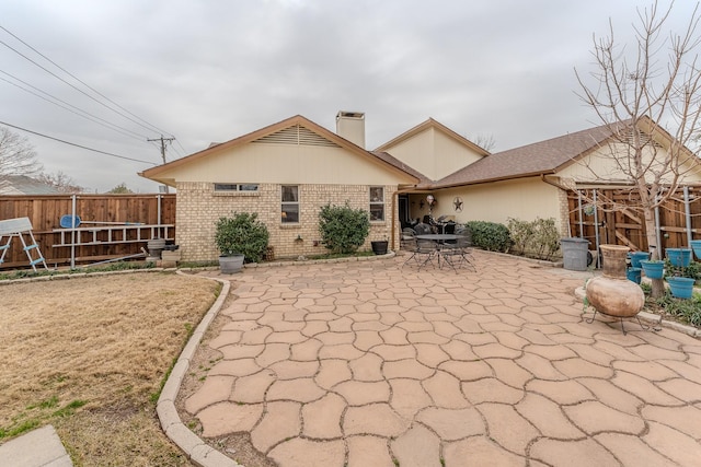 back of house with a patio area