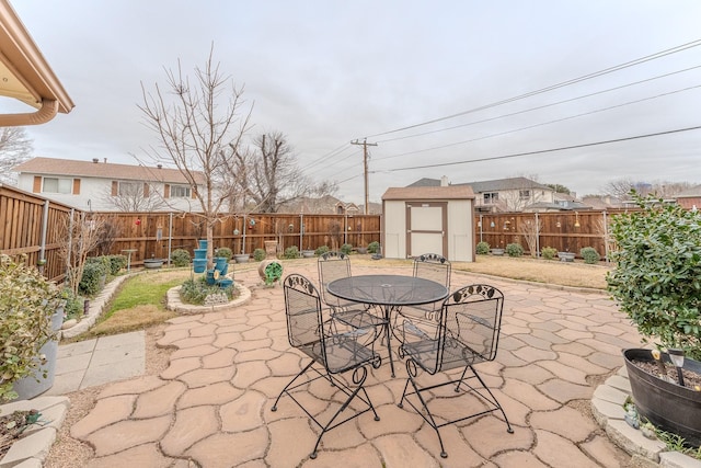 view of patio with a storage shed