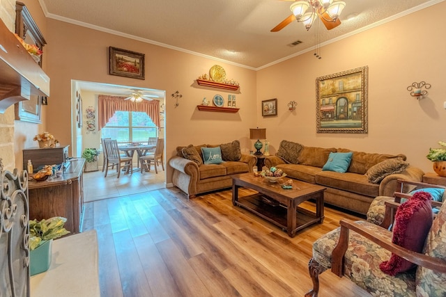 living room featuring crown molding, ceiling fan, and hardwood / wood-style floors