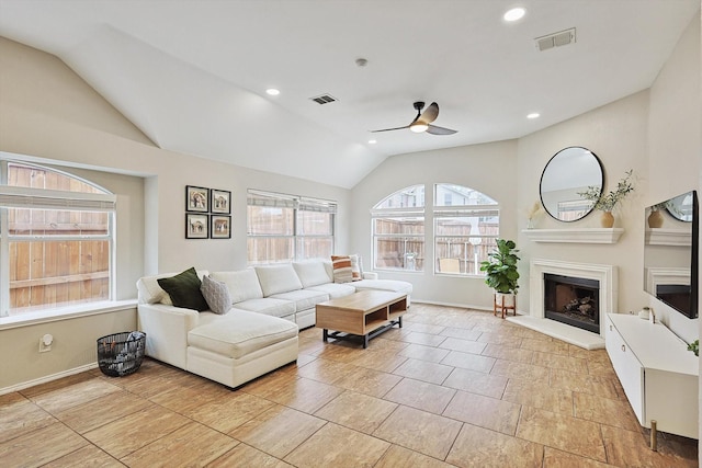 living room with lofted ceiling and ceiling fan