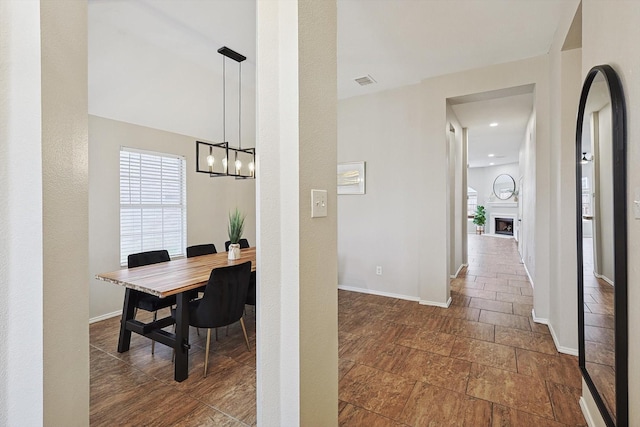 hallway featuring an inviting chandelier