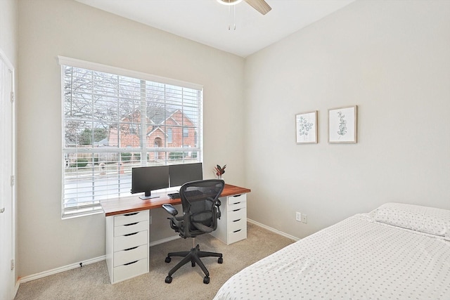 carpeted bedroom with ceiling fan