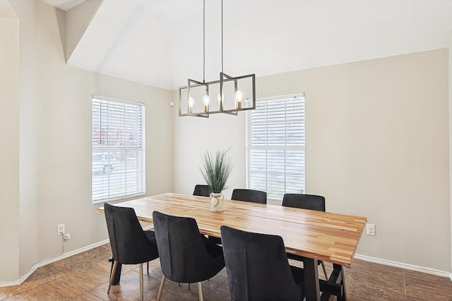 dining area featuring an inviting chandelier