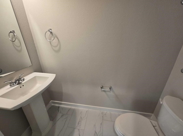 bathroom featuring toilet