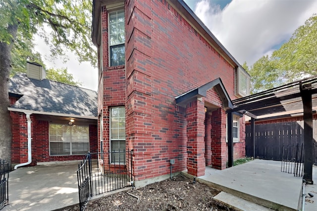 view of side of property featuring a patio