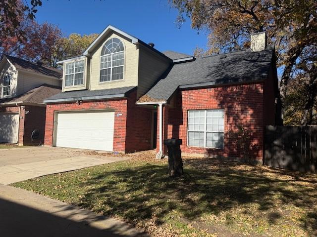 front of property featuring a garage and a front yard