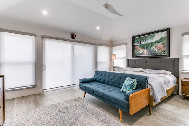 bedroom with ceiling fan and light wood-type flooring