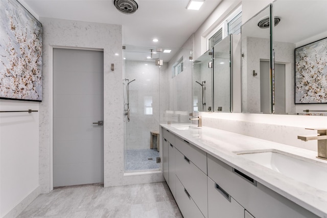 bathroom featuring vanity and an enclosed shower