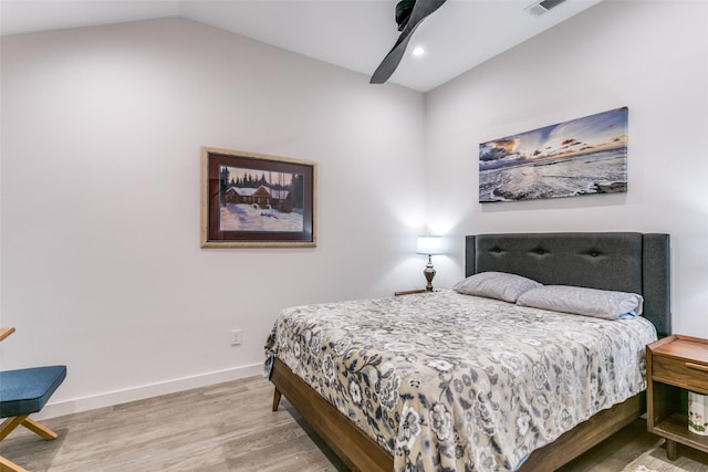 bedroom featuring ceiling fan, wood-type flooring, and lofted ceiling