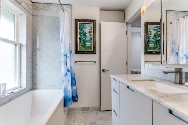 bathroom with shower / bath combination with curtain and vanity