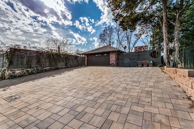 view of patio / terrace with a garage