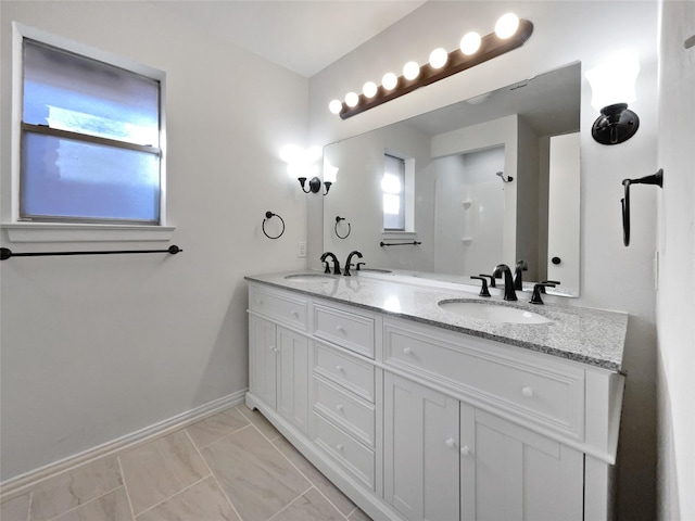 bathroom with tile patterned floors and vanity