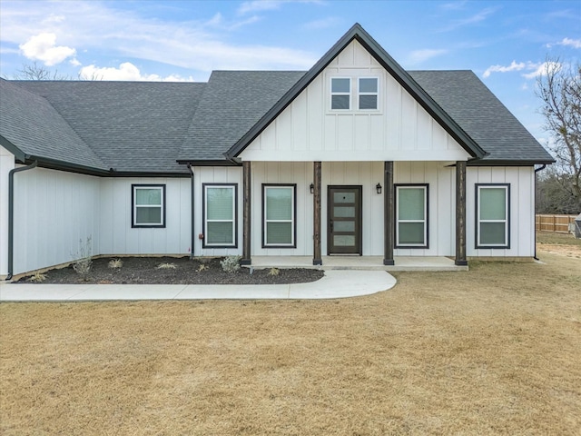 view of front facade with a front lawn and a porch