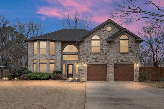 french provincial home with a garage