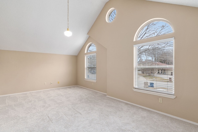 bonus room featuring light carpet and lofted ceiling