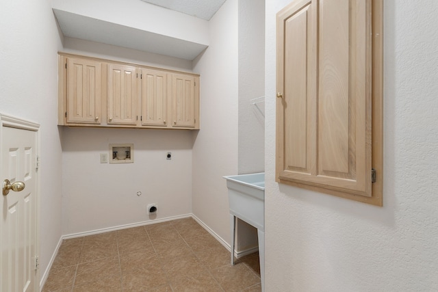 washroom with gas dryer hookup, cabinets, washer hookup, and hookup for an electric dryer