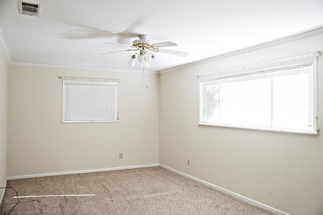 carpeted empty room featuring crown molding and ceiling fan