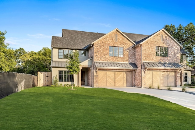 view of front of house with a garage and a front yard