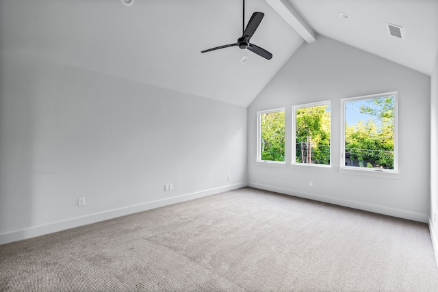 unfurnished room featuring ceiling fan, carpet, and vaulted ceiling with beams