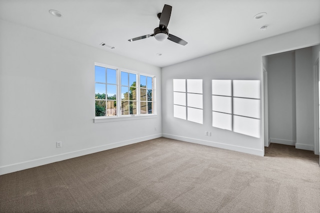 interior space with ceiling fan