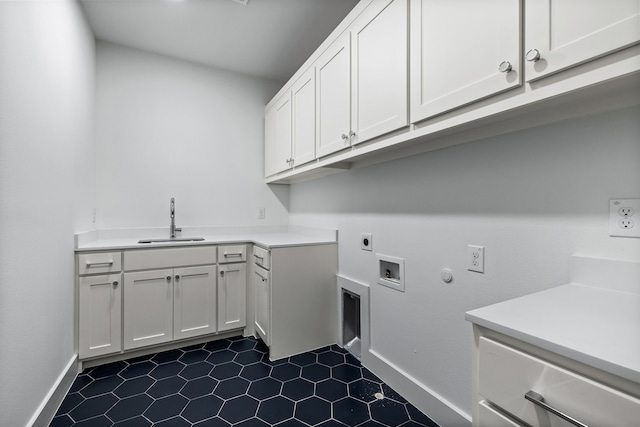 laundry room featuring sink, cabinets, hookup for a washing machine, hookup for an electric dryer, and hookup for a gas dryer