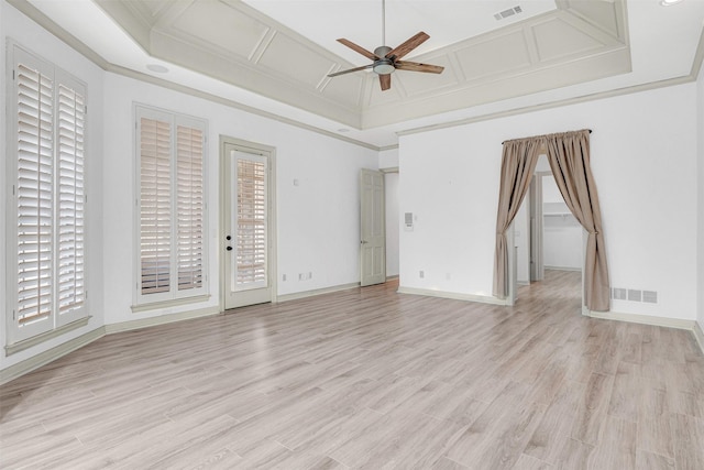 spare room with coffered ceiling, light hardwood / wood-style flooring, ornamental molding, and ceiling fan