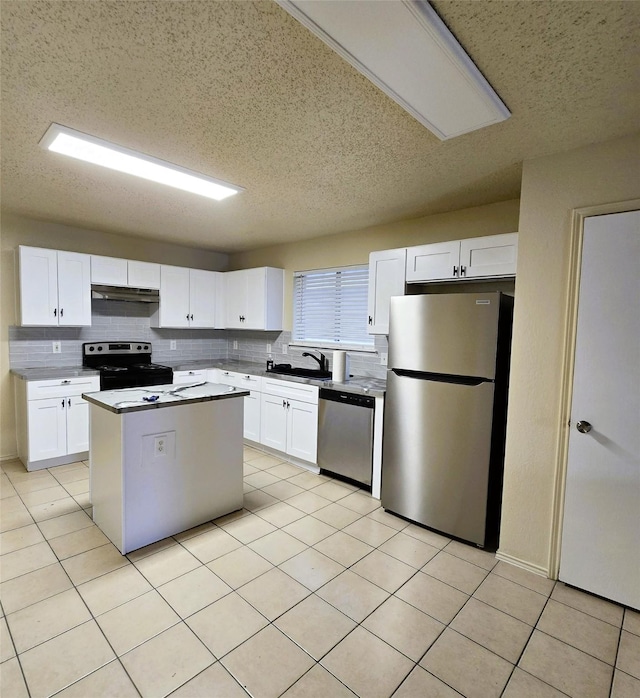 kitchen with white cabinetry, sink, a kitchen island, and appliances with stainless steel finishes