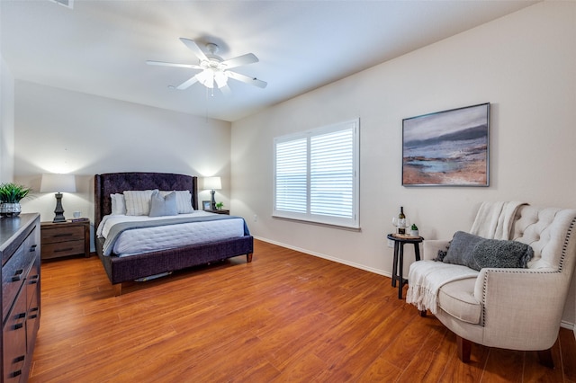 bedroom with hardwood / wood-style floors and ceiling fan