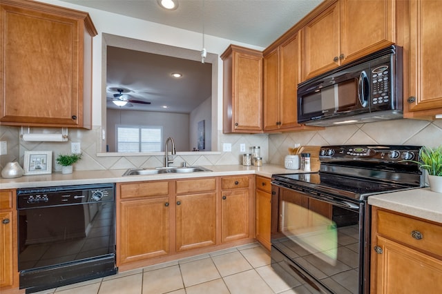 kitchen featuring light tile patterned flooring, backsplash, sink, and black appliances