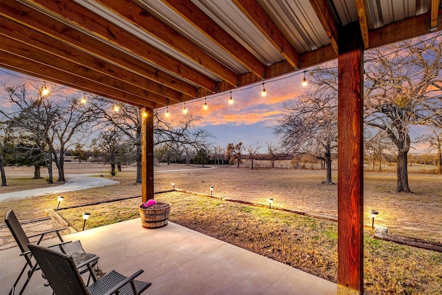 view of patio terrace at dusk