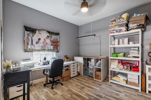 office area with wood-type flooring and ceiling fan