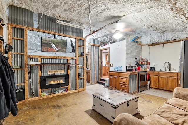 living room featuring sink and a fireplace