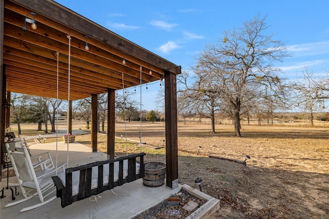 view of yard with a patio and a rural view